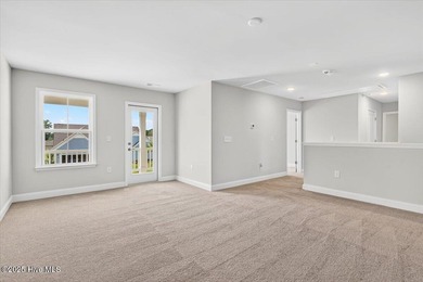 Experience elevated coastal living in this luxury 4-bedroom home on Crow Creek Golf Club in North Carolina - for sale on GolfHomes.com, golf home, golf lot