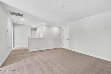 Experience elevated coastal living in this luxury 4-bedroom home on Crow Creek Golf Club in North Carolina - for sale on GolfHomes.com, golf home, golf lot