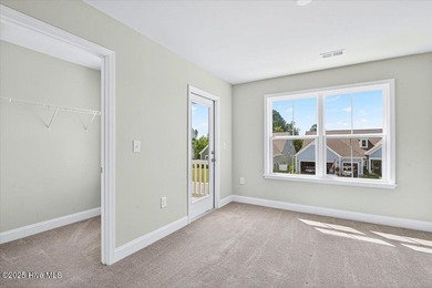 Experience elevated coastal living in this luxury 4-bedroom home on Crow Creek Golf Club in North Carolina - for sale on GolfHomes.com, golf home, golf lot