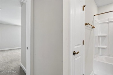 Experience elevated coastal living in this luxury 4-bedroom home on Crow Creek Golf Club in North Carolina - for sale on GolfHomes.com, golf home, golf lot