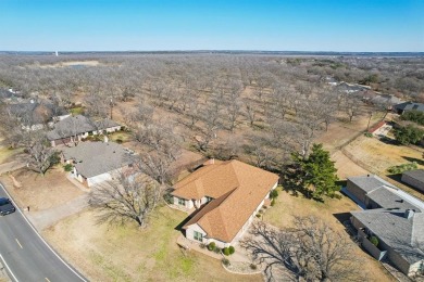 BETTER THAN NEW...This beautiful custom built fully updated home on Pecan Plantation Country Club in Texas - for sale on GolfHomes.com, golf home, golf lot