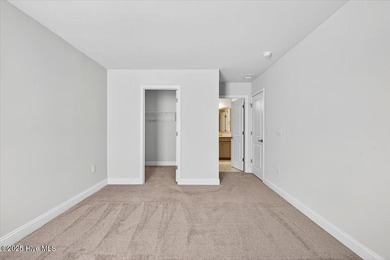 Experience elevated coastal living in this luxury 4-bedroom home on Crow Creek Golf Club in North Carolina - for sale on GolfHomes.com, golf home, golf lot