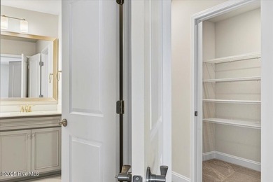 Experience elevated coastal living in this luxury 4-bedroom home on Crow Creek Golf Club in North Carolina - for sale on GolfHomes.com, golf home, golf lot