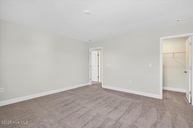 Experience elevated coastal living in this luxury 4-bedroom home on Crow Creek Golf Club in North Carolina - for sale on GolfHomes.com, golf home, golf lot