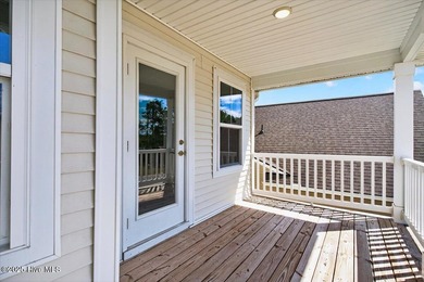Experience elevated coastal living in this luxury 4-bedroom home on Crow Creek Golf Club in North Carolina - for sale on GolfHomes.com, golf home, golf lot