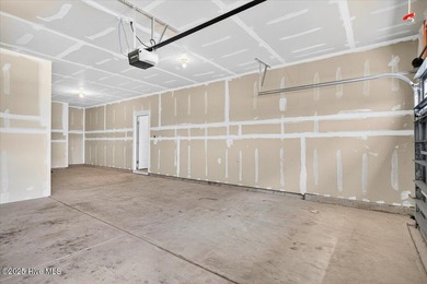 Experience elevated coastal living in this luxury 4-bedroom home on Crow Creek Golf Club in North Carolina - for sale on GolfHomes.com, golf home, golf lot