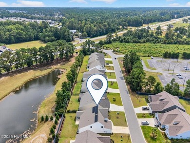 Experience elevated coastal living in this luxury 4-bedroom home on Crow Creek Golf Club in North Carolina - for sale on GolfHomes.com, golf home, golf lot