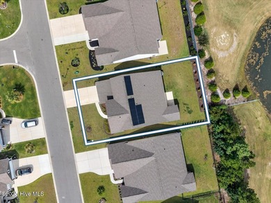 Experience elevated coastal living in this luxury 4-bedroom home on Crow Creek Golf Club in North Carolina - for sale on GolfHomes.com, golf home, golf lot