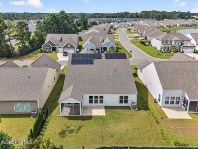 Experience elevated coastal living in this luxury 4-bedroom home on Crow Creek Golf Club in North Carolina - for sale on GolfHomes.com, golf home, golf lot