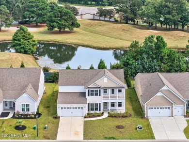 Experience elevated coastal living in this luxury 4-bedroom home on Crow Creek Golf Club in North Carolina - for sale on GolfHomes.com, golf home, golf lot