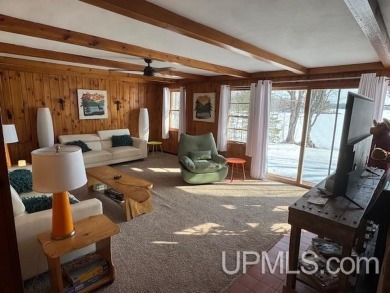 Enjoy the quaint rustic ambience of this northwoods cottage on Wyandotte Hills Golf Course in Michigan - for sale on GolfHomes.com, golf home, golf lot