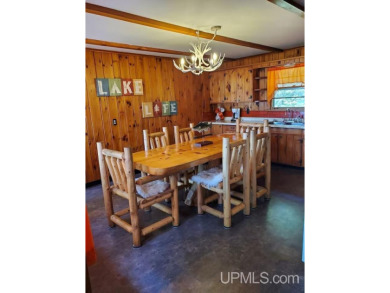 Enjoy the quaint rustic ambience of this northwoods cottage on Wyandotte Hills Golf Course in Michigan - for sale on GolfHomes.com, golf home, golf lot