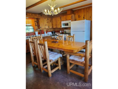 Enjoy the quaint rustic ambience of this northwoods cottage on Wyandotte Hills Golf Course in Michigan - for sale on GolfHomes.com, golf home, golf lot