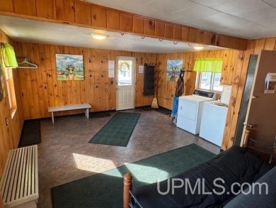Enjoy the quaint rustic ambience of this northwoods cottage on Wyandotte Hills Golf Course in Michigan - for sale on GolfHomes.com, golf home, golf lot