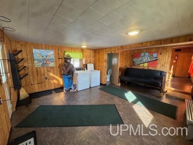 Enjoy the quaint rustic ambience of this northwoods cottage on Wyandotte Hills Golf Course in Michigan - for sale on GolfHomes.com, golf home, golf lot
