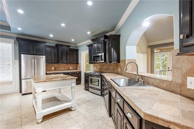 Exceptional location! This charming home backs up to Rago Trail on Bella Vista - Metfield Golf Complex and Country Club in Arkansas - for sale on GolfHomes.com, golf home, golf lot