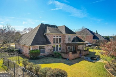 Welcome to luxury living in this exquisite 4-sided brick home on Crystal Lake Golf and Country Club in Georgia - for sale on GolfHomes.com, golf home, golf lot