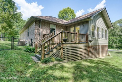 Brick Basement Ranch with two car garage on main level and on Lake Tansi Village Country Club in Tennessee - for sale on GolfHomes.com, golf home, golf lot