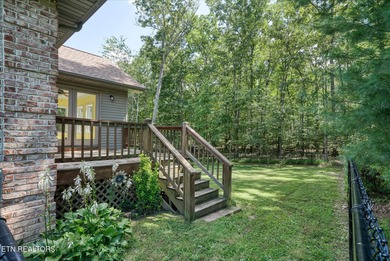 Brick Basement Ranch with two car garage on main level and on Lake Tansi Village Country Club in Tennessee - for sale on GolfHomes.com, golf home, golf lot