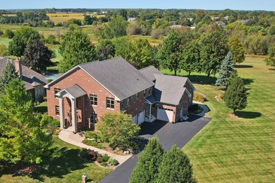 This custom all-brick estate offers rare scale, construction on RedTail Golf Club in Illinois - for sale on GolfHomes.com, golf home, golf lot