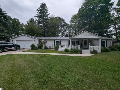 An immaculate home with deeded beach access along Lake Huron in on Singing Bridge Golf Course in Michigan - for sale on GolfHomes.com, golf home, golf lot