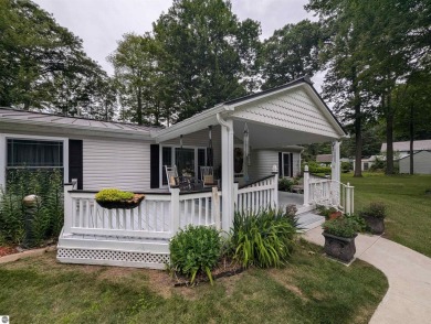 An immaculate home with deeded beach access along Lake Huron in on Singing Bridge Golf Course in Michigan - for sale on GolfHomes.com, golf home, golf lot