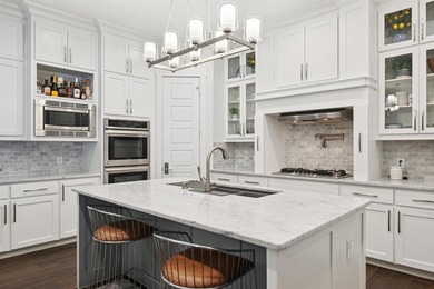 Welcome to this stunning custom Greenbriar home ideally situated on Heath Golf and Yacht Club in Texas - for sale on GolfHomes.com, golf home, golf lot