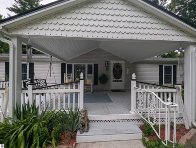 An immaculate home with deeded beach access along Lake Huron in on Singing Bridge Golf Course in Michigan - for sale on GolfHomes.com, golf home, golf lot