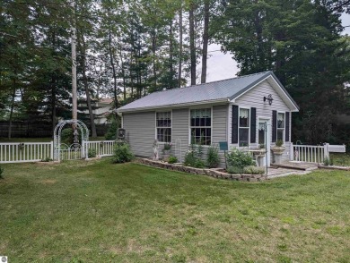 An immaculate home with deeded beach access along Lake Huron in on Singing Bridge Golf Course in Michigan - for sale on GolfHomes.com, golf home, golf lot