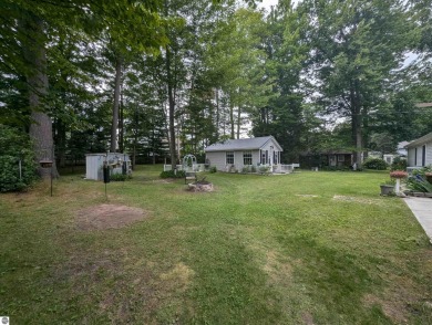 An immaculate home with deeded beach access along Lake Huron in on Singing Bridge Golf Course in Michigan - for sale on GolfHomes.com, golf home, golf lot