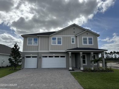 Two-story home, the Heron Elevation B model, located at Lot 130 on LPGA International Golf Course in Florida - for sale on GolfHomes.com, golf home, golf lot