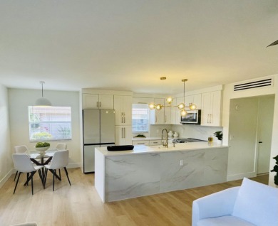 This is a must see new and custom designed CORNER VILLA! on Kings Point Golf -Flanders Way in Florida - for sale on GolfHomes.com, golf home, golf lot
