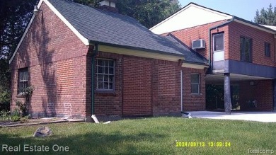 PROPERTY REPAIRED.  BEAUTIFUL CURB APPEAL ON THIS RAISED RANCH on Western Golf and Country Club in Michigan - for sale on GolfHomes.com, golf home, golf lot