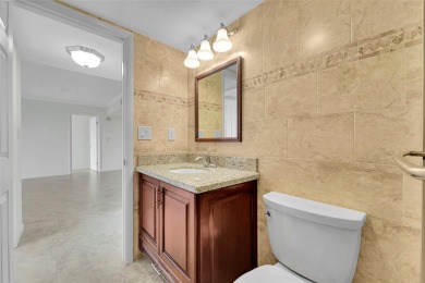 BEAUTIFUL CITY VIEWS FROM THIS UPDATED 2 BEDROOM 2 BATHROOM on Country Club of Coral Springs in Florida - for sale on GolfHomes.com, golf home, golf lot