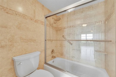 BEAUTIFUL CITY VIEWS FROM THIS UPDATED 2 BEDROOM 2 BATHROOM on Country Club of Coral Springs in Florida - for sale on GolfHomes.com, golf home, golf lot