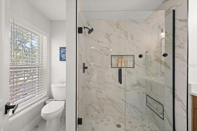 Nestled on one of Celebration's picturesque, tree-lined streets on Celebration Golf Club in Florida - for sale on GolfHomes.com, golf home, golf lot