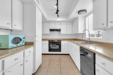 Imagine peaceful mornings on your wrap-around patio, surrounded on Sun Lakes Country Club in Arizona - for sale on GolfHomes.com, golf home, golf lot