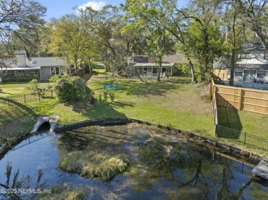 ALL BRICK BEAUTY situated on one of the largest lots in Pablo on Queens Harbour Yacht and Country Club in Florida - for sale on GolfHomes.com, golf home, golf lot