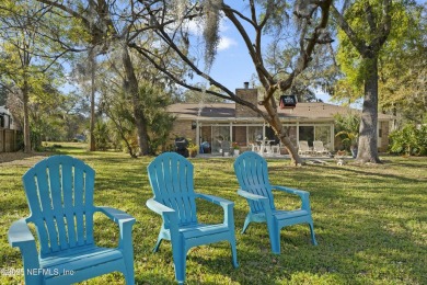 ALL BRICK BEAUTY situated on one of the largest lots in Pablo on Queens Harbour Yacht and Country Club in Florida - for sale on GolfHomes.com, golf home, golf lot