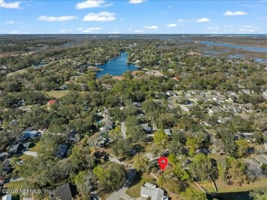 ALL BRICK BEAUTY situated on one of the largest lots in Pablo on Queens Harbour Yacht and Country Club in Florida - for sale on GolfHomes.com, golf home, golf lot