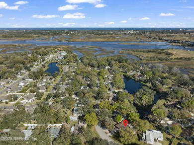 ALL BRICK BEAUTY situated on one of the largest lots in Pablo on Queens Harbour Yacht and Country Club in Florida - for sale on GolfHomes.com, golf home, golf lot