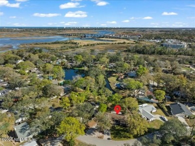 ALL BRICK BEAUTY situated on one of the largest lots in Pablo on Queens Harbour Yacht and Country Club in Florida - for sale on GolfHomes.com, golf home, golf lot