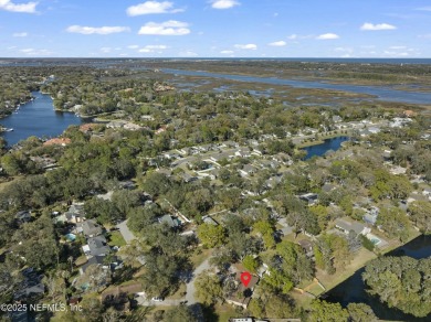 ALL BRICK BEAUTY situated on one of the largest lots in Pablo on Queens Harbour Yacht and Country Club in Florida - for sale on GolfHomes.com, golf home, golf lot