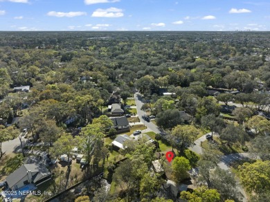 ALL BRICK BEAUTY situated on one of the largest lots in Pablo on Queens Harbour Yacht and Country Club in Florida - for sale on GolfHomes.com, golf home, golf lot