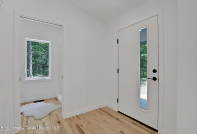 Experience modern simplicity in this newly built, thoughtfully on Rip Van Winkle Country Club in New York - for sale on GolfHomes.com, golf home, golf lot
