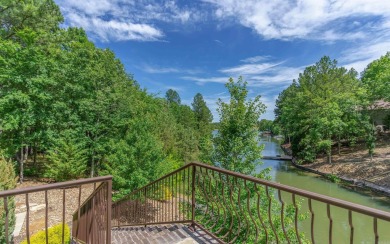 Stunning all-brick and stone lakefront home on Lake Granada in on Granada Golf Course in Arkansas - for sale on GolfHomes.com, golf home, golf lot