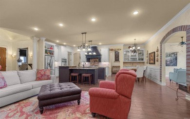 Stunning all-brick and stone lakefront home on Lake Granada in on Granada Golf Course in Arkansas - for sale on GolfHomes.com, golf home, golf lot