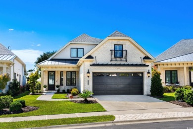 Beautifully designed and custom-built, this two-story brick home on The Dunes Golf and Beach Club in South Carolina - for sale on GolfHomes.com, golf home, golf lot