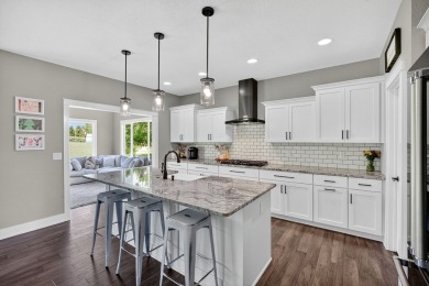 Welcome to 1150 Cardinal Drive-a thoughtfully designed, move-in on Tournament Club of Iowa in Iowa - for sale on GolfHomes.com, golf home, golf lot