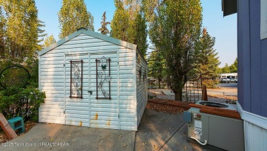 Discover a charming park model in the heart of Star Valley Ranch on Star Valley RV Golf Course in Wyoming - for sale on GolfHomes.com, golf home, golf lot